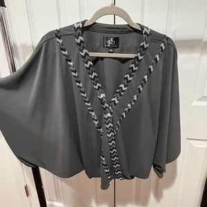 Grey batwing shirt with rhinestone design by Sheri Bodell size small